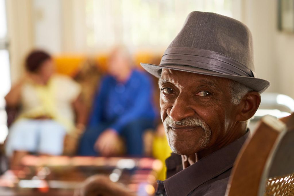 Older man sitting in an assisted care facility